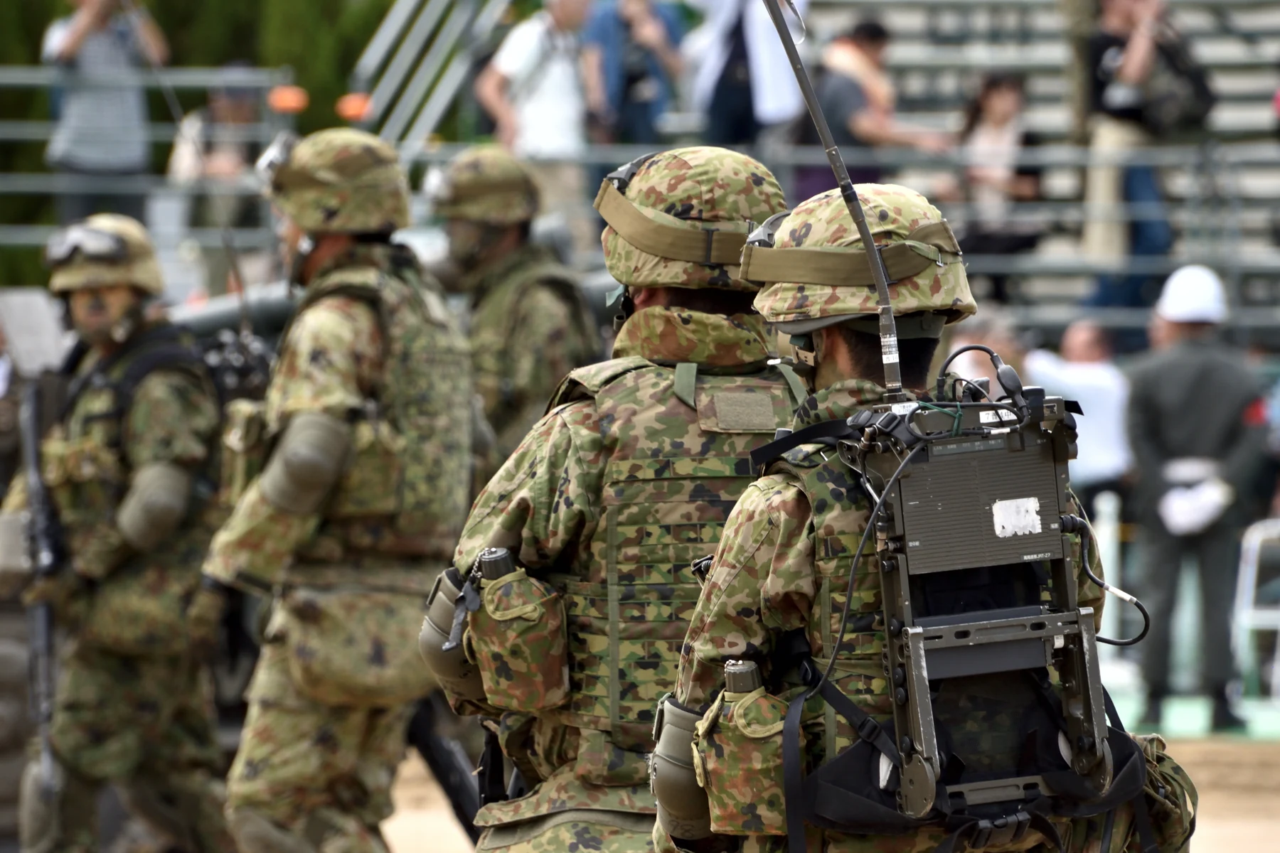 Illustrative personnel carrying field communications equipment